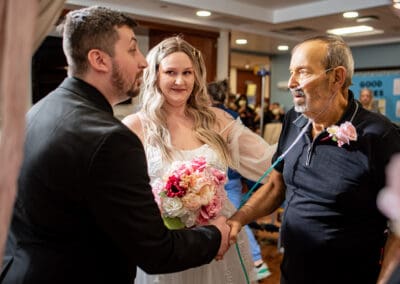 Father gives away the bride
