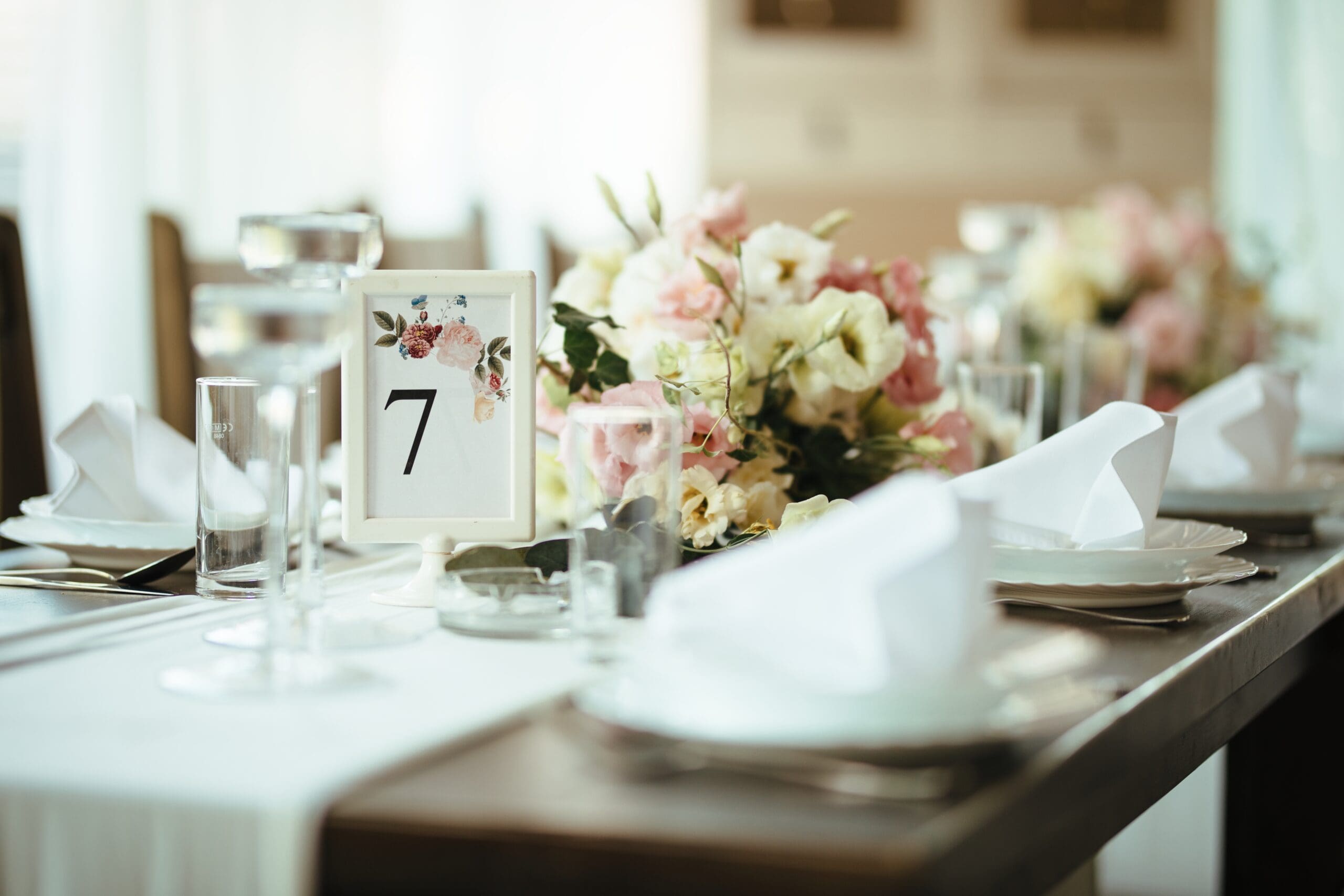 Elegant wedding table setting Elegant wedding reception table setting with floral centerpiece and candles
